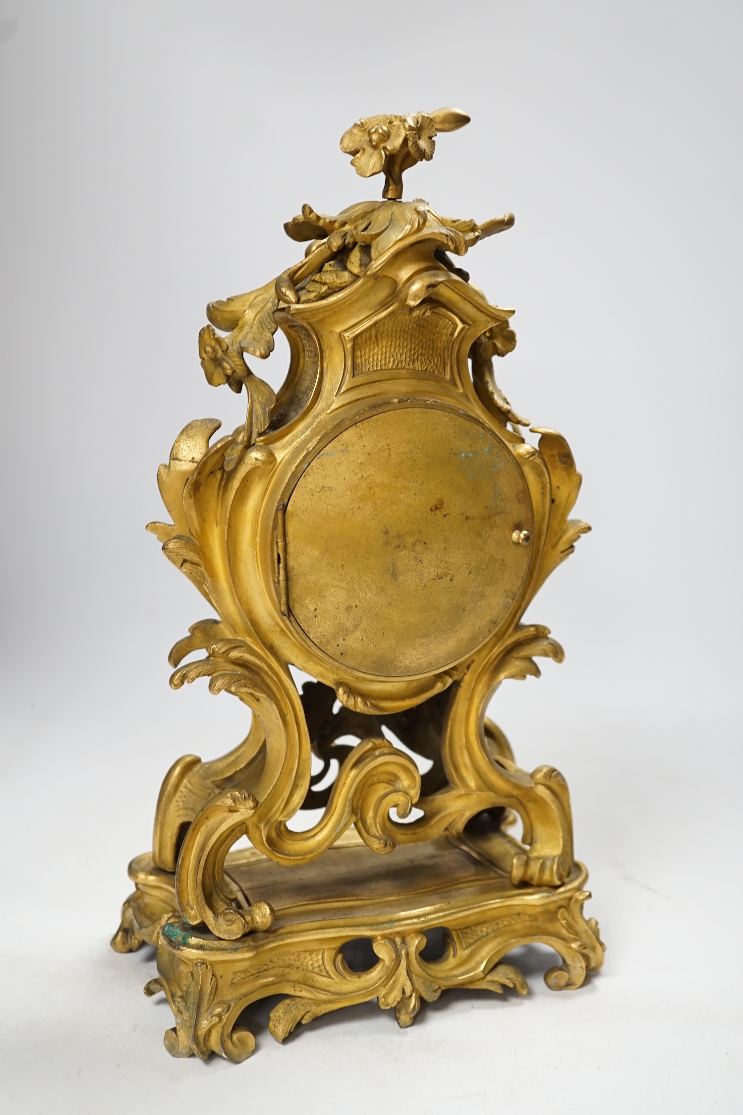 A 19th century French gilt metal mantel clock with Roman numeral dial, no key, pendulum a.f, 35cm high. Condition - fair